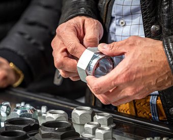 Visitor holding a product at Fastener Fair Italy